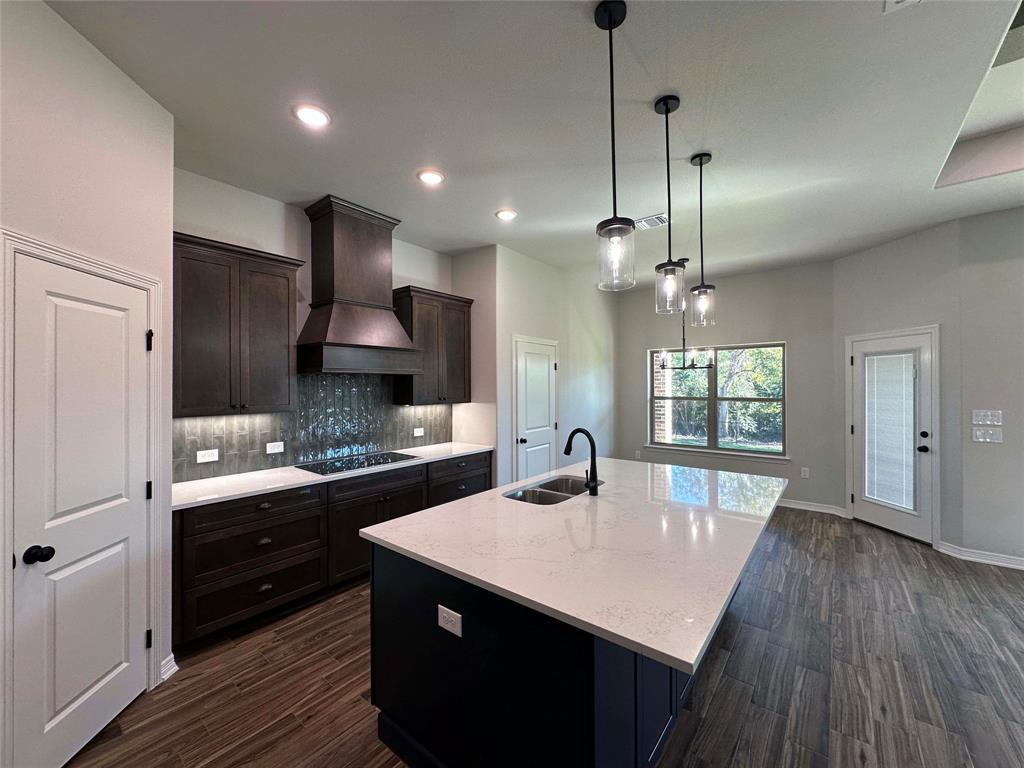 133 Lasso Loop Lorena, TX 76655 - Photo 8 of 22 a kitchen with counter space a sink appliances and cabinets