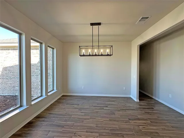 a kitchen with counter space a sink appliances and cabinets