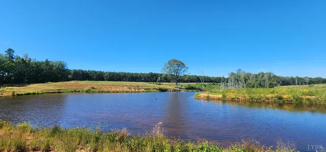 a view of lake with green space