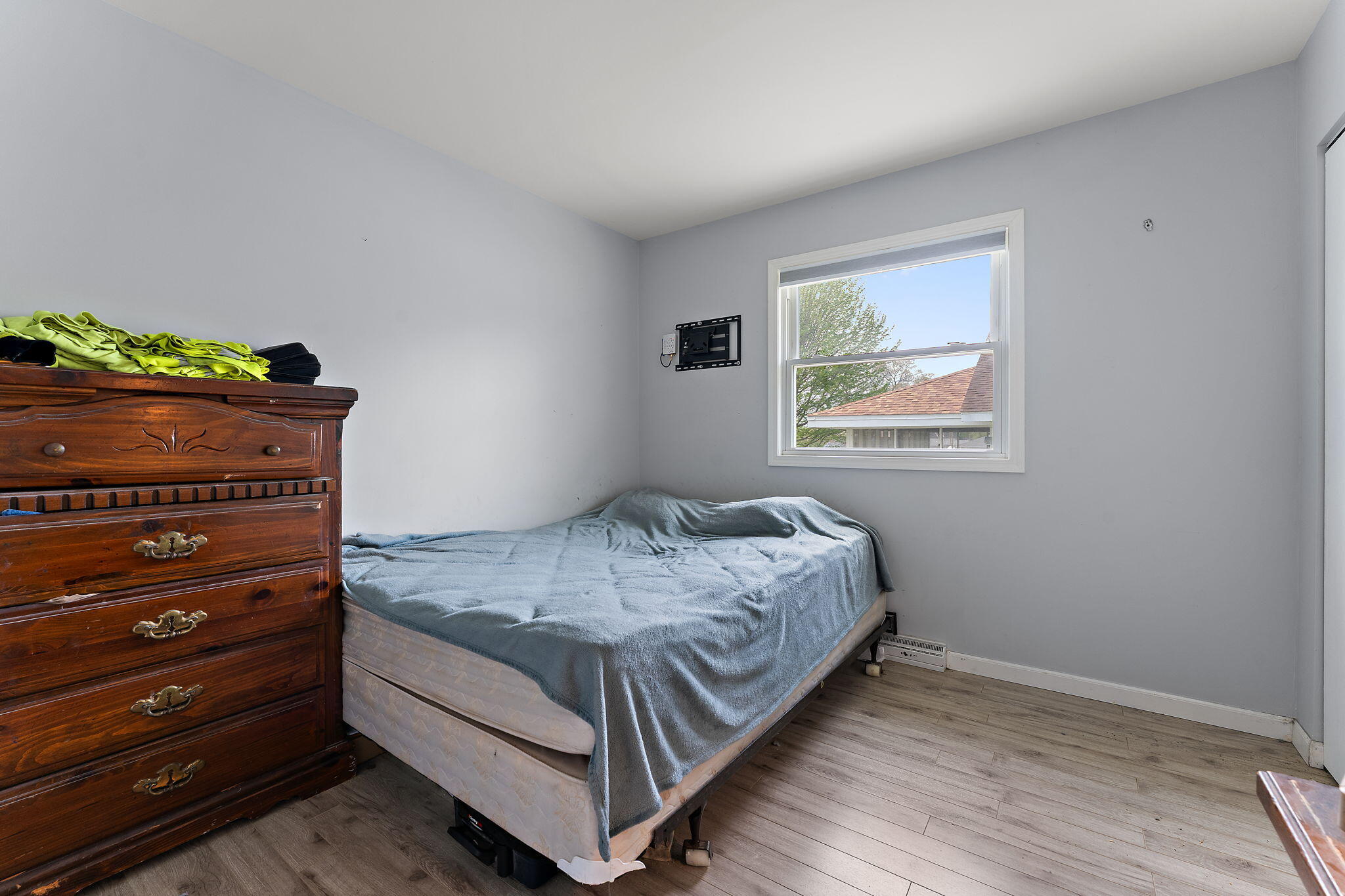 5590 East Maple Street Knox, IN 46534 - Photo 16 of 32 a bed sitting in a bedroom next to a window