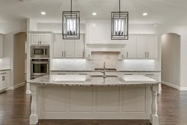 a view of a room with wooden floor and outdoor view