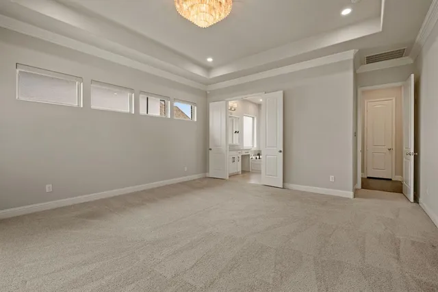 a white bath tub sitting next to a bathroom sink