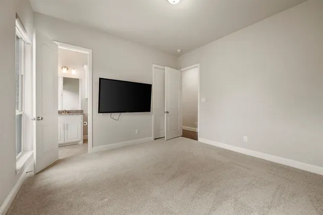 a bathroom with a granite countertop toilet sink and a mirror