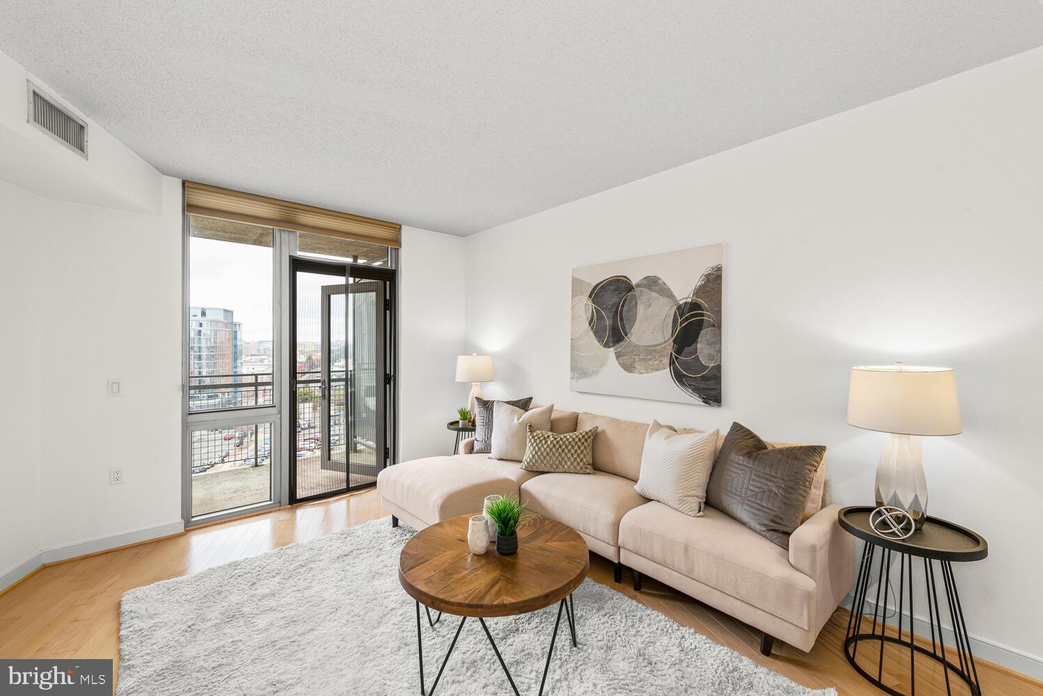 a living room with furniture and a lamp