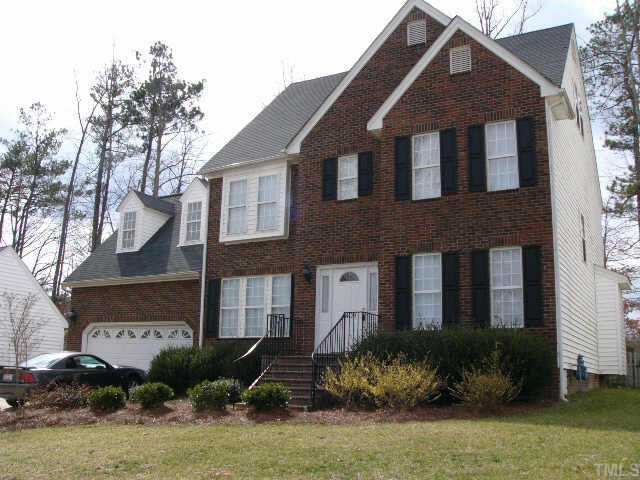 4409 Oakside Court Raleigh, NC 27609 - Photo 1 of 1 a front view of a house with a yard