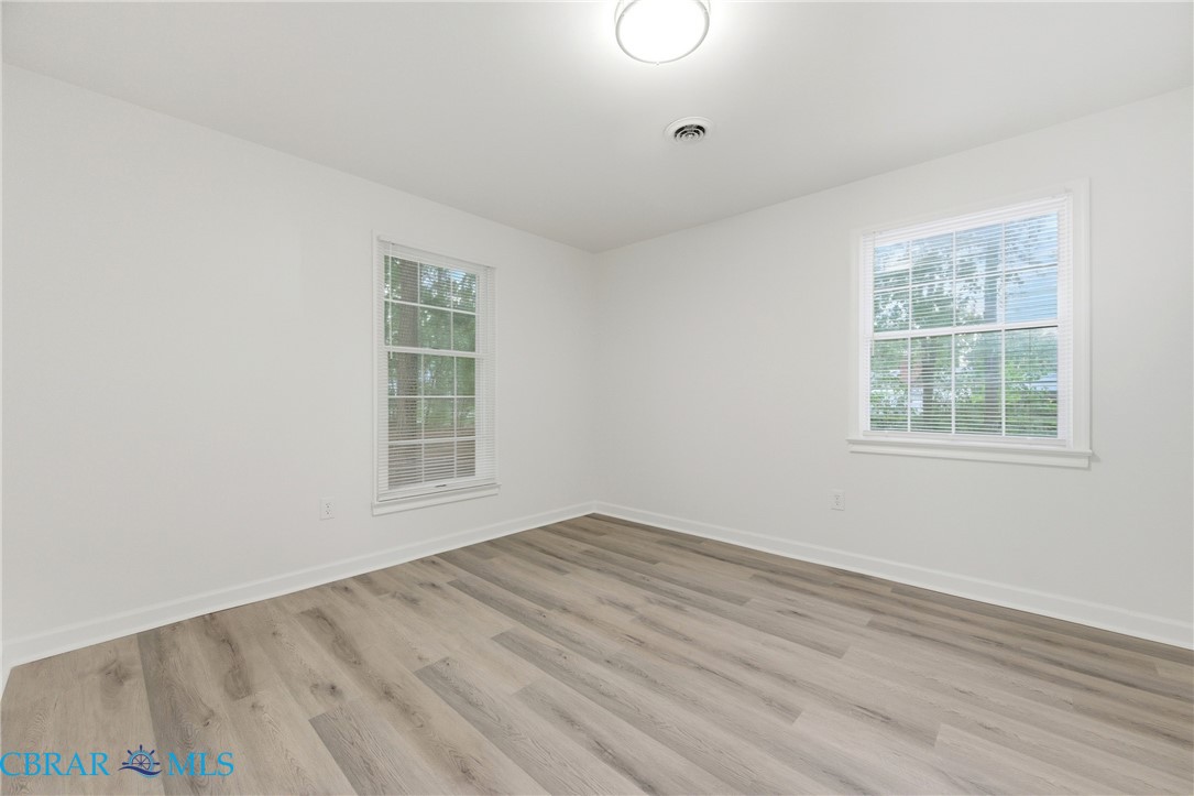 718 Dandy Loop Road Yorktown, VA 23692 - Photo 16 of 42 Spare room with light wood-type flooring and baseboards
