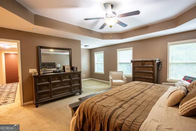 a walk in closet with a rug