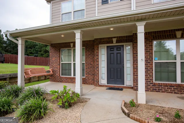 a front view of a house with a porch