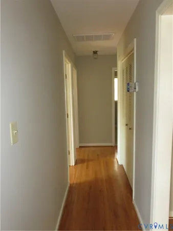 a bathroom with a sink mirror and toilet