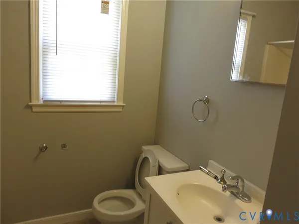 a bathroom with a window and a shower