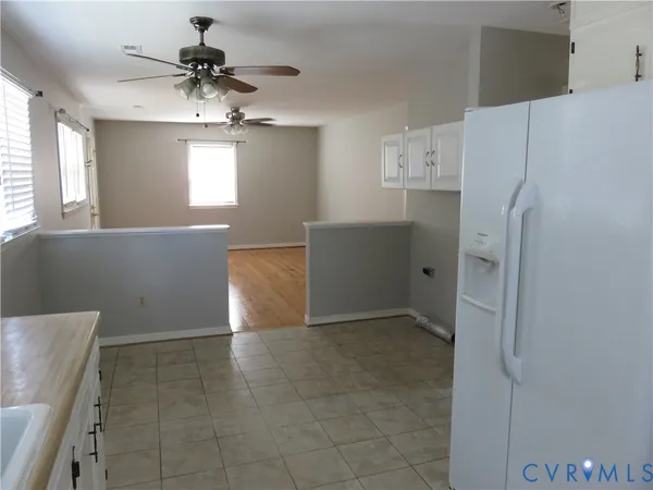 a kitchen with stainless steel appliances a counter space and a window