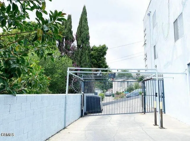 a view of a city with lush green forest