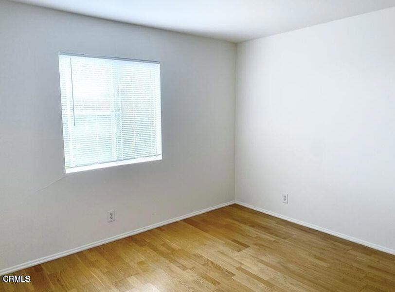 4018 Camero Avenue, Unit 2 Los Angeles, CA 90027 - Photo 5 of 14 an empty room with a window