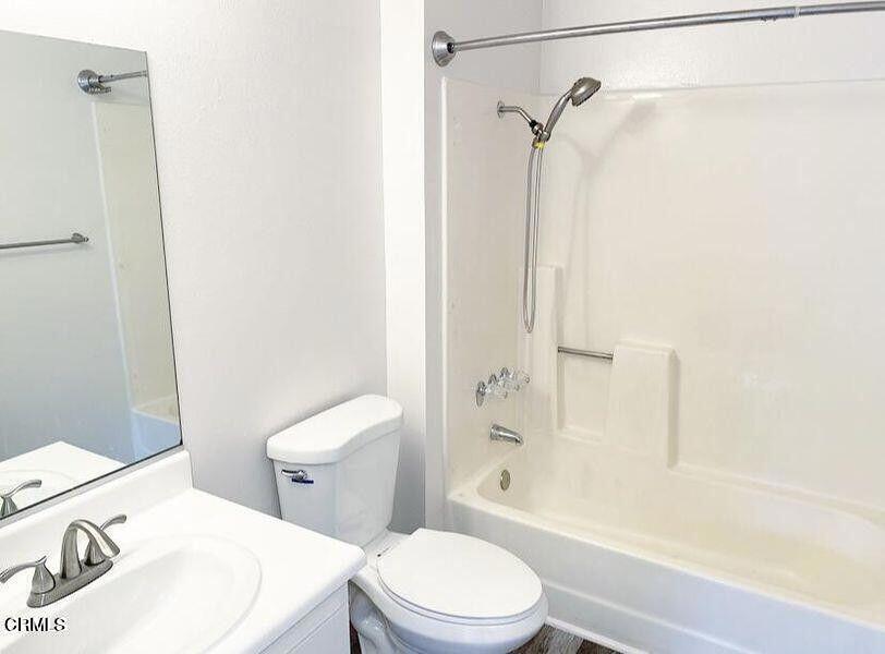 4018 Camero Avenue, Unit 2 Los Angeles, CA 90027 - Photo 9 of 14 a white toilet sitting next to a bath tub