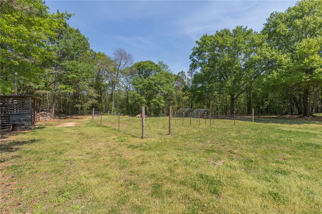 820 Travis Road Anderson, SC 29626 - Photo 38 of 46 Expansive outdoor space offering a secluded setting with mature trees and endless possibilities.