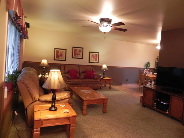 1034 Southgate Road New Lenox, IL 60451 - Photo 2 of 21 a living room with furniture and a flat screen tv