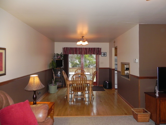 1034 Southgate Road New Lenox, IL 60451 - Photo 3 of 21 a living room with furniture and a chandelier