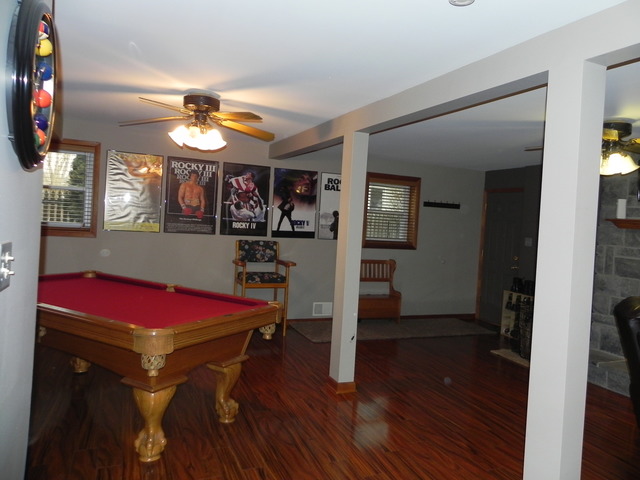 1034 Southgate Road New Lenox, IL 60451 - Photo 9 of 21 a view of a room with wooden floor and furniture