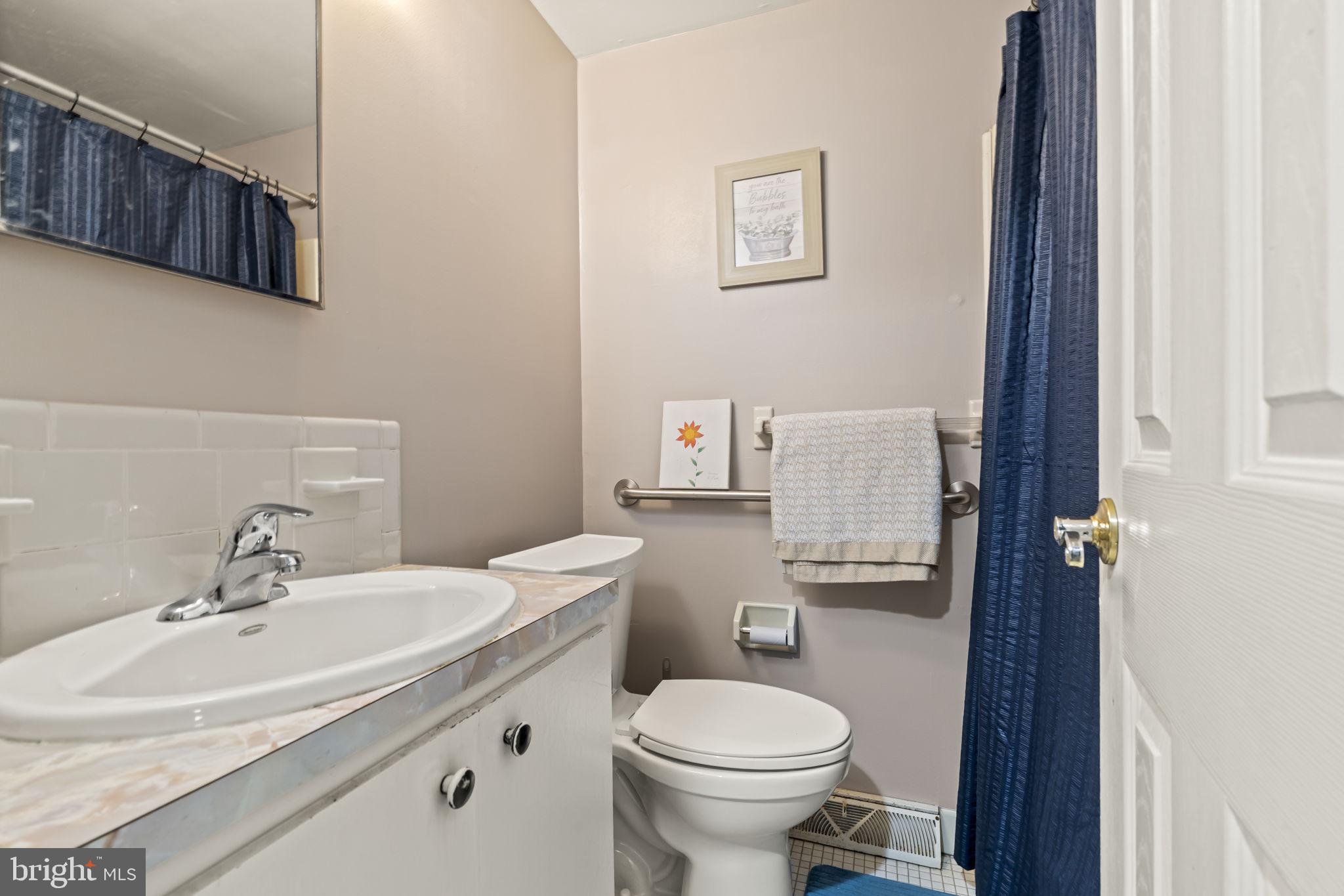 4 Margy Lane Marlton, NJ 08053 - Photo 27 of 46 a bathroom with a sink toilet and a mirror