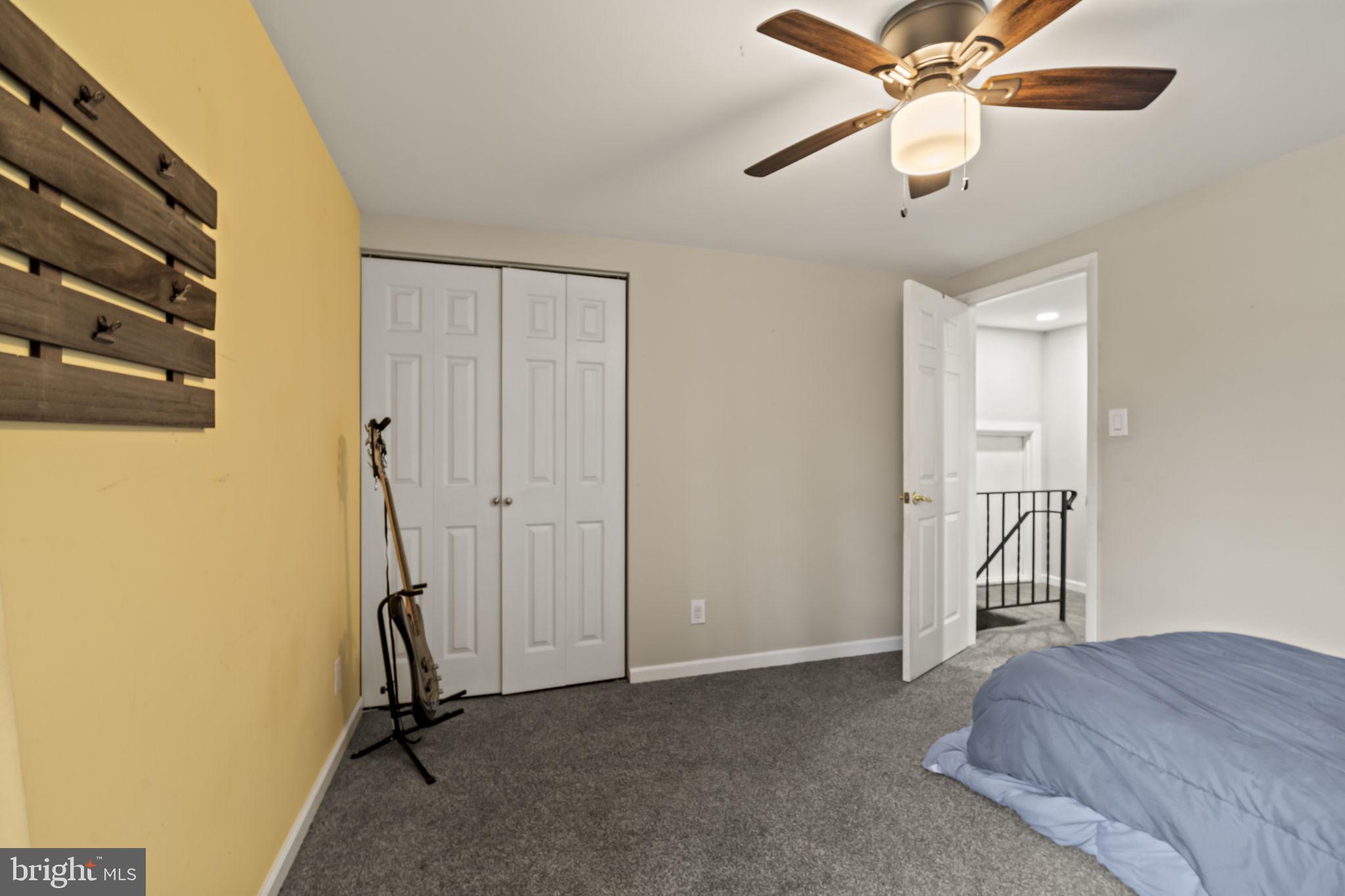 4 Margy Lane Marlton, NJ 08053 - Photo 31 of 46 a view of a bedroom with a hanging light and a ceiling fan
