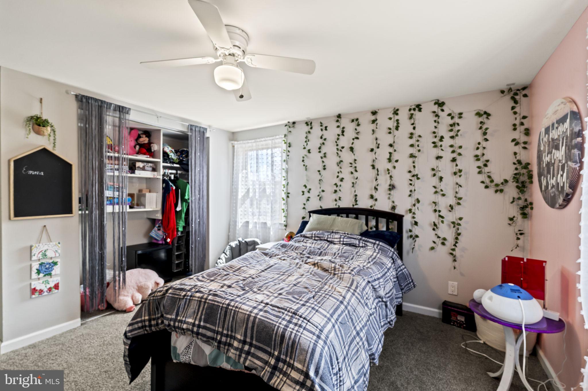 4 Margy Lane Marlton, NJ 08053 - Photo 33 of 46 a bedroom with bed and a chandelier