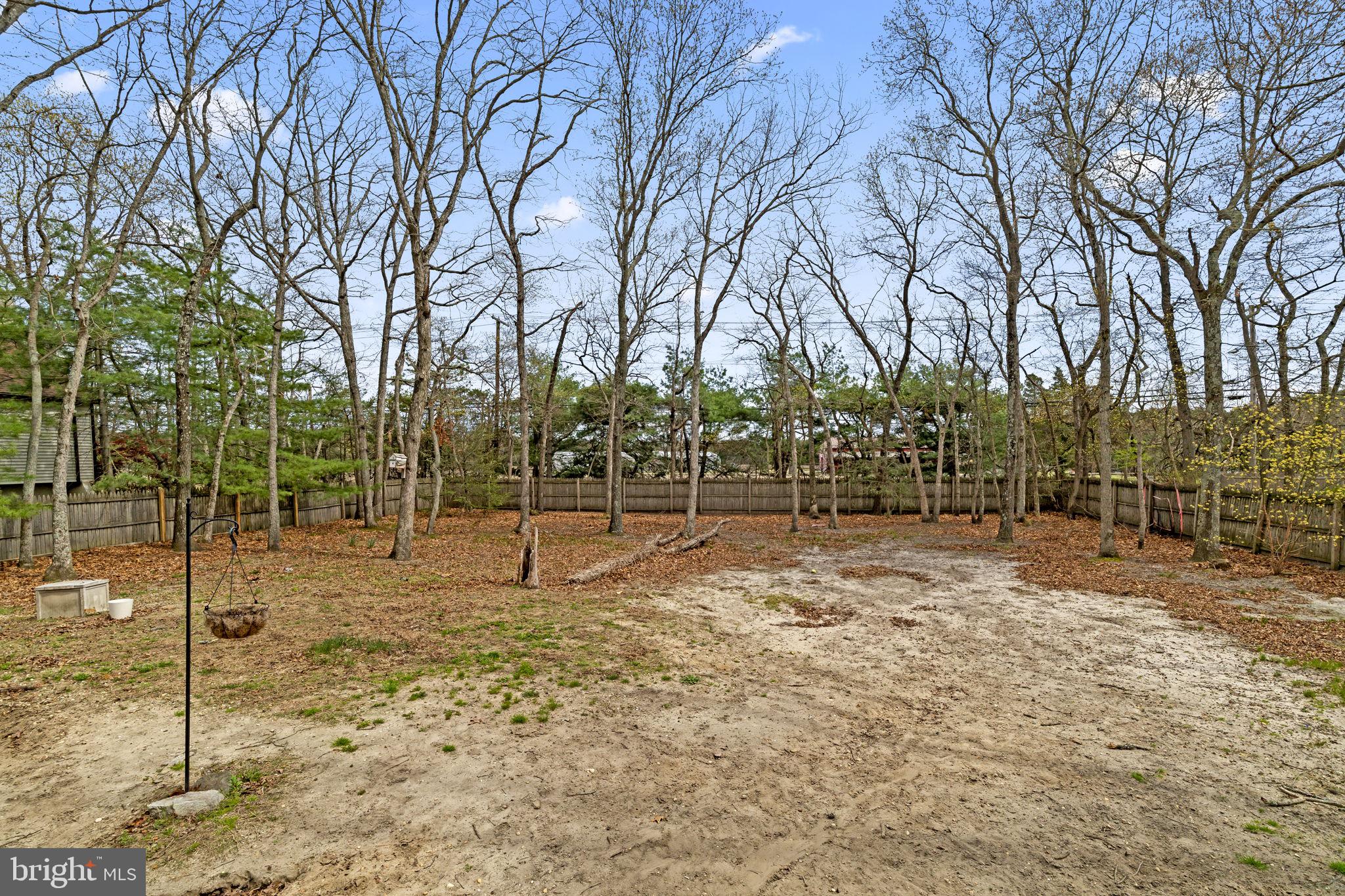 4 Margy Lane Marlton, NJ 08053 - Photo 40 of 46 a backyard of apartments with large trees