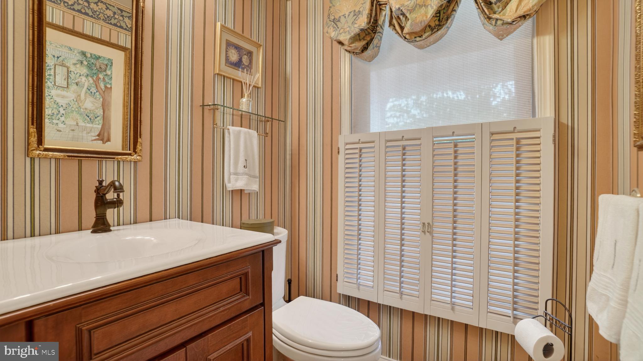 317 Canterfield Road Annapolis, MD 21403 - Photo 26 of 66 a bathroom with a sink a toilet and shower curtain