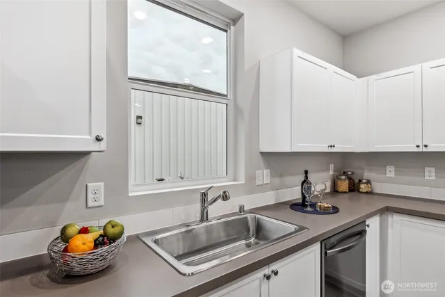 a kitchen with a sink and cabinets