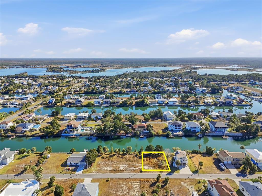 3302 Gardenia Drive Hernando Beach, FL 34607 - Photo 3 of 14 an aerial view of a city and lake view