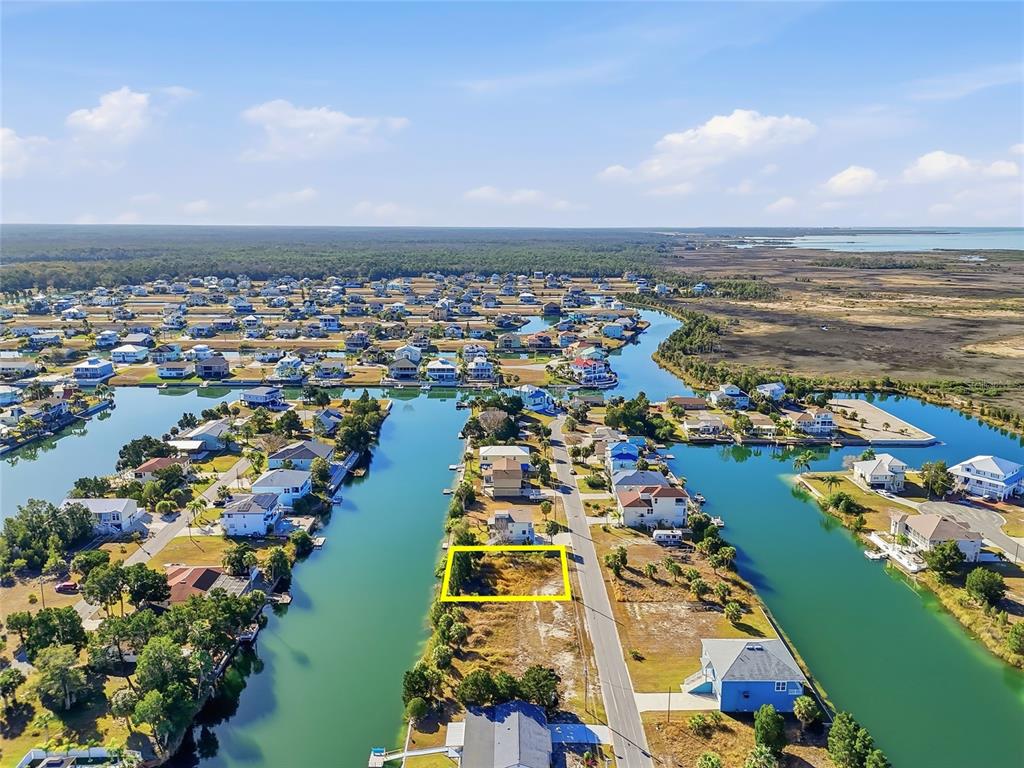 3302 Gardenia Drive Hernando Beach, FL 34607 - Photo 4 of 14 an aerial view of residential building and lake
