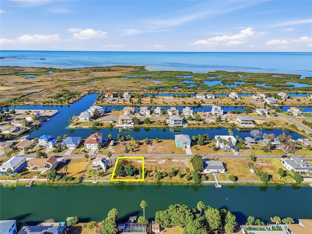 3302 Gardenia Drive Hernando Beach, FL 34607 - Photo 5 of 14 an aerial view of ocean and residential houses with outdoor space