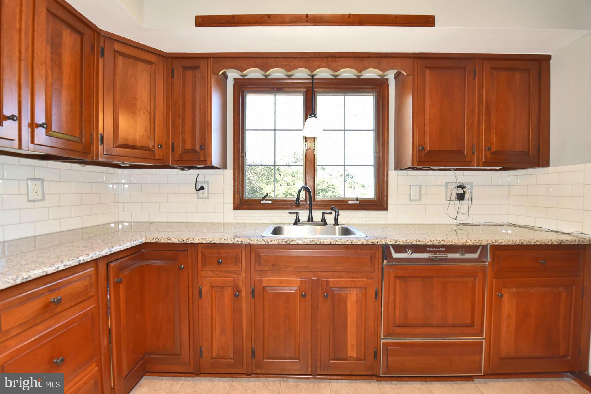 2214 Furnace Road Fallston, MD 21047 - Photo 8 of 30 a kitchen with stainless steel appliances granite countertop wooden cabinets a sink and a counter space