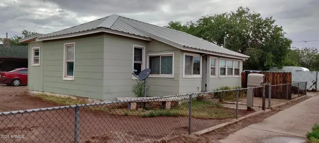 a house with trees in the background