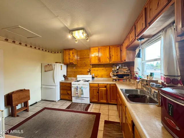 a kitchen with lots of counter top space and appliances