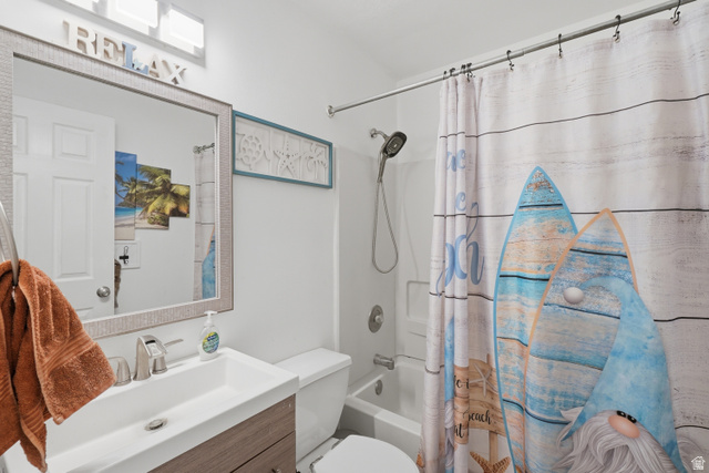 2135 East White Pine Road Eagle Mountain, UT 84005 - Photo 13 of 23 Full bathroom featuring a single vanity with rectangular sink, polished chrome faucet, and wood-finish cabinetry
