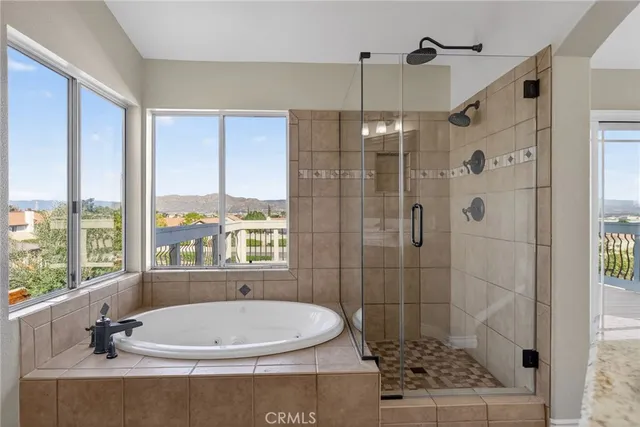 a bathroom with a bathtub and shower