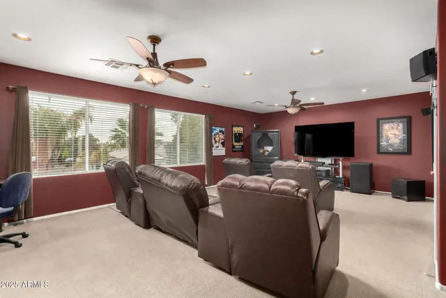 a bedroom with a bed a dresser and chair