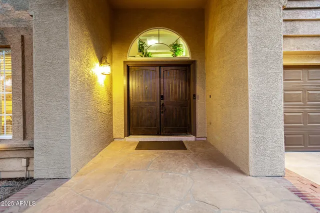 a living room with furniture a table and a large window