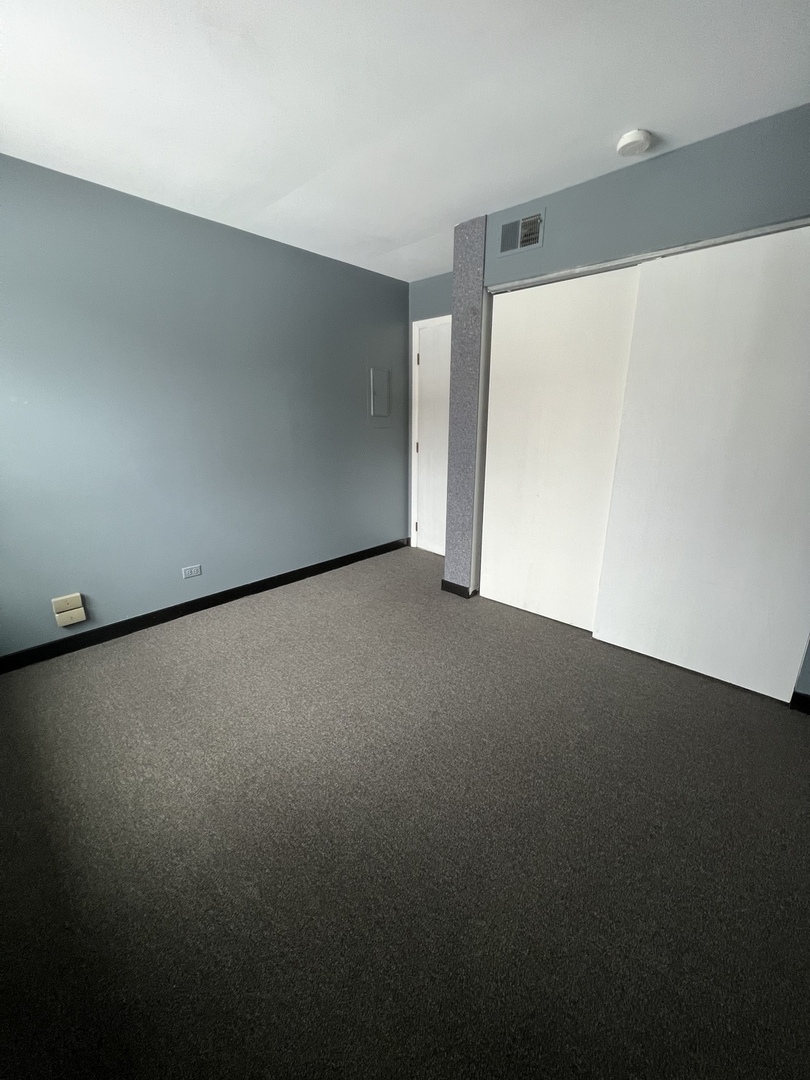 1111 Pleasant Run Drive, Unit 902 Wheeling, IL 60090 - Photo 6 of 7 a view of an empty room