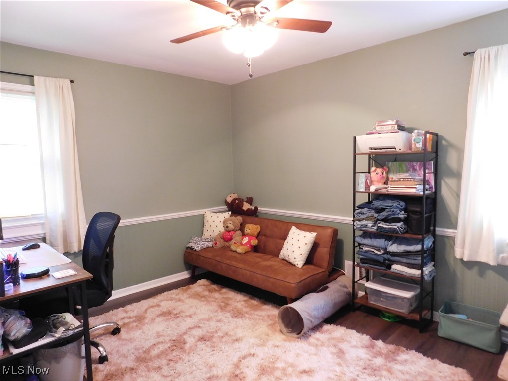 9720 West Ridgewood Drive Parma Heights, OH 44130 - Photo 25 of 46 featuring a ceiling fan, wood finished floors, and baseboards