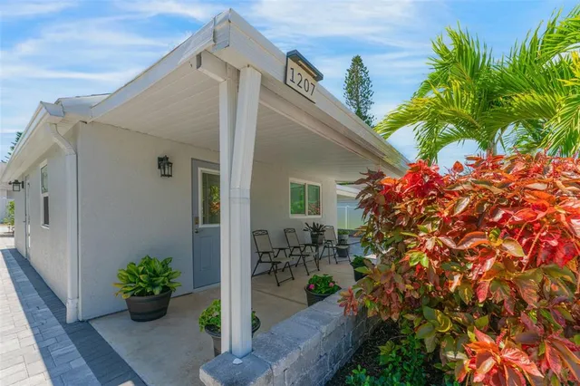 a kitchen with a white cabinets and couches