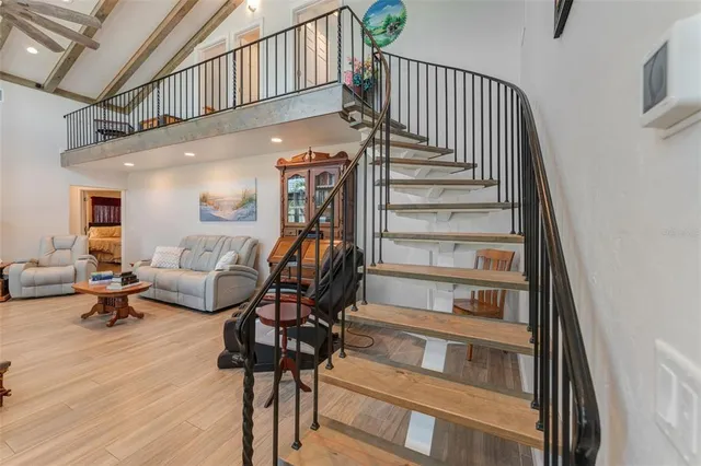 a view of a living room with furniture and a window