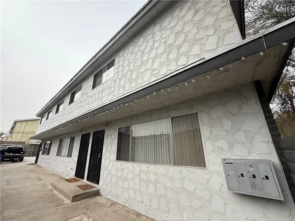 a front view of a house with parking space