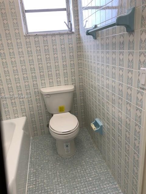 2690 Southwest 22nd Avenue, Unit 505 Miami, FL 33133 - Photo 12 of 21 a bathroom with a toilet and a shower