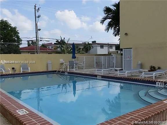 2690 Southwest 22nd Avenue, Unit 505 Miami, FL 33133 - Photo 2 of 21 a view of a swimming pool with a lake view