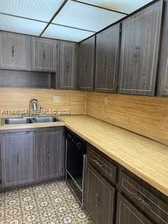 a kitchen with a sink and cabinets