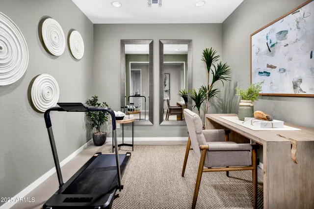 a bedroom with bed and a couch