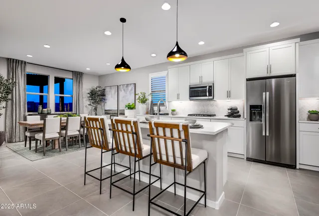 a kitchen with cabinets a sink and appliances