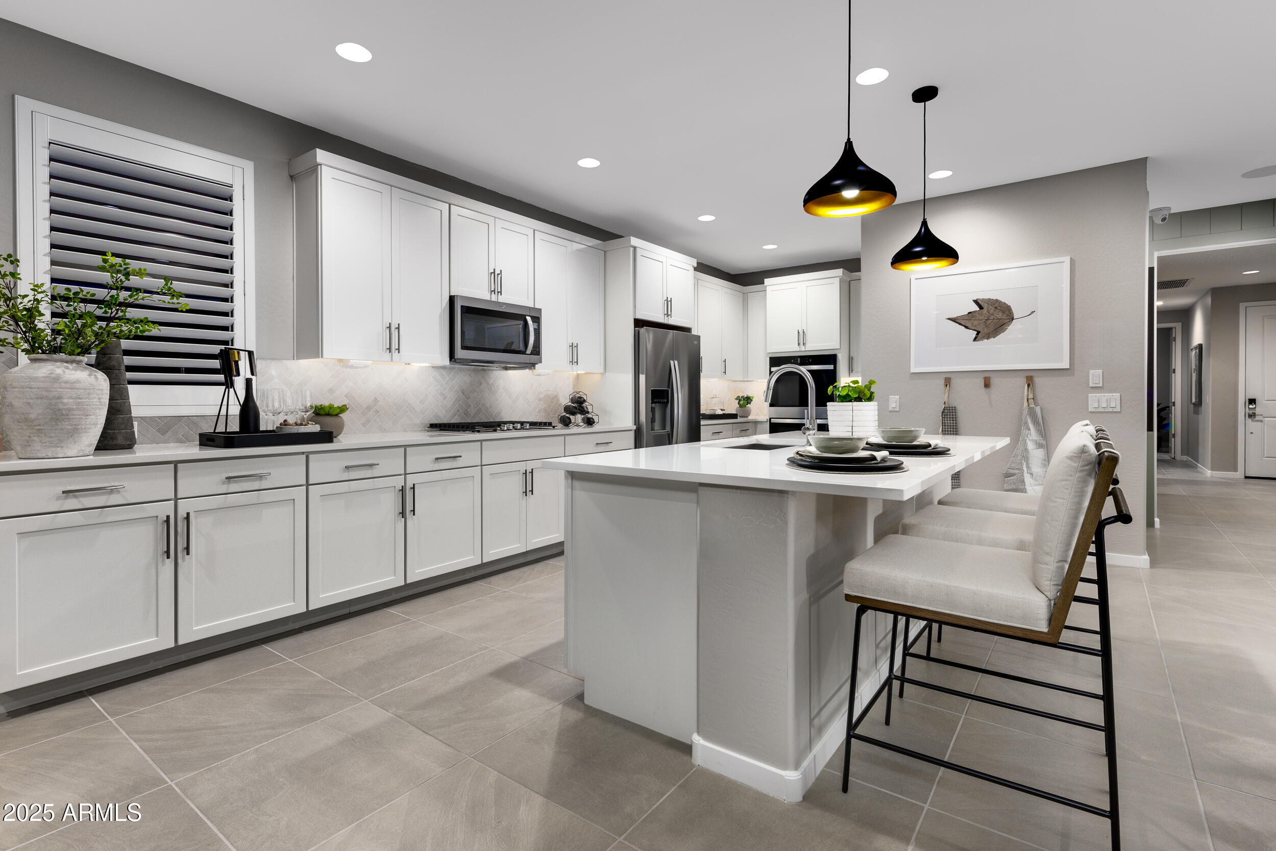 9784 Gold Stone Trail Apache Junction, AZ 85120 - Photo 7 of 46 a kitchen with cabinets a sink and appliances