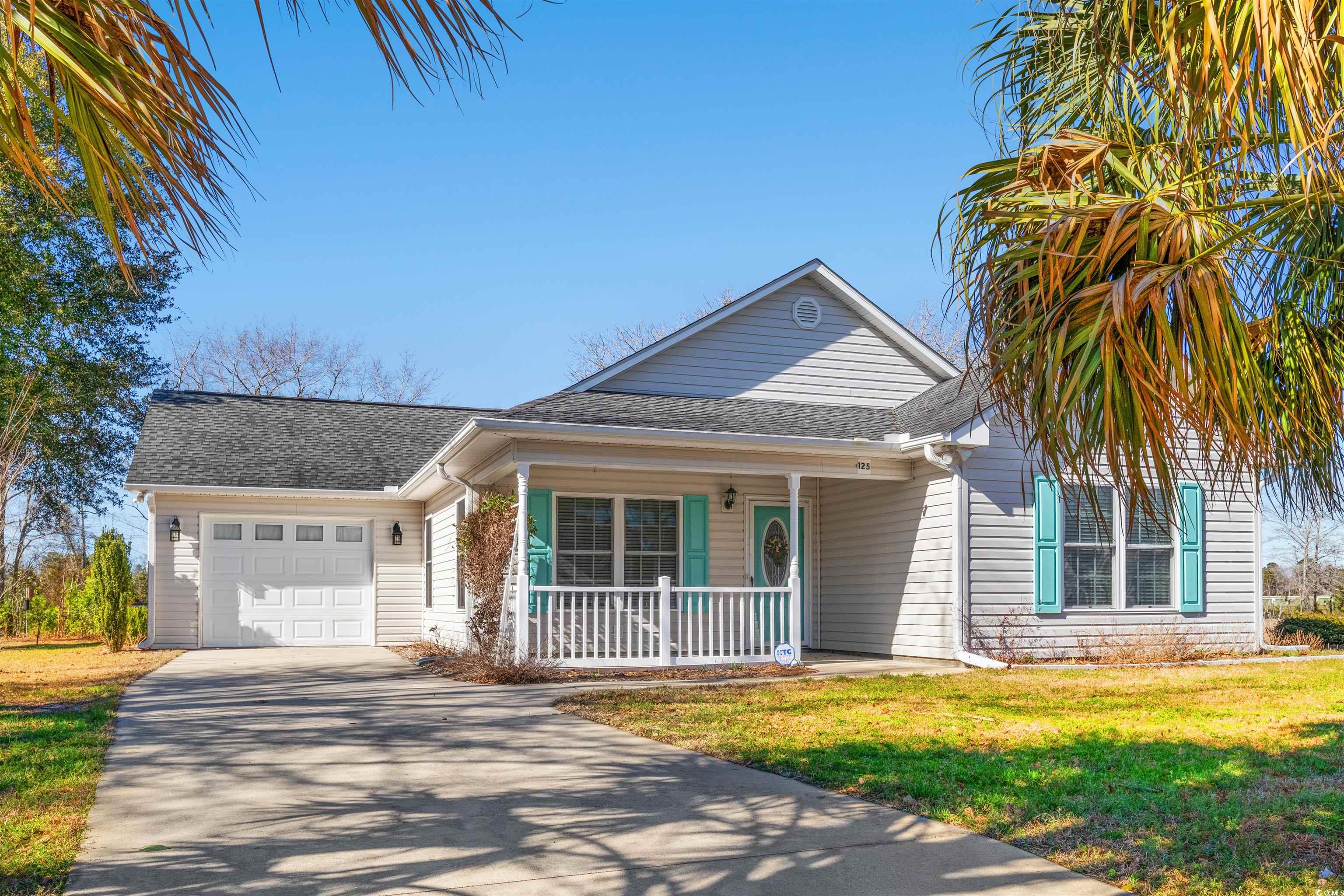 125 Dayglow Drive Loris, SC 29569 - Photo 1 of 24 View of front facade with a garage, a shingled roo